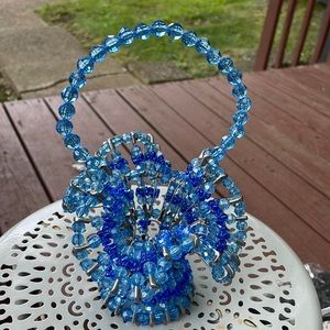 Handmade blue beaded basket
Sold